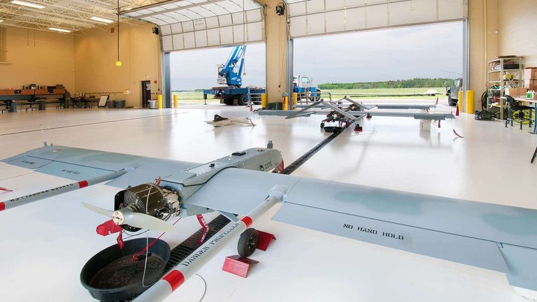 Hangar with unmanned aircraft on the apron